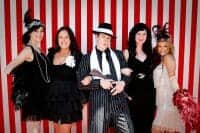 Company Christmas Party with employees dressed up for gangster theme